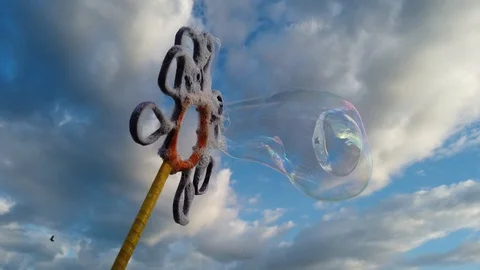 Bubbles with blue sky background with clouds Video stock 100941489
