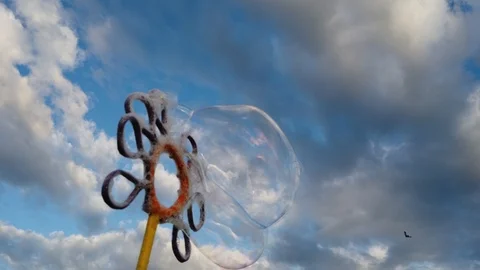 Bubbles with blue sky background with clouds Video stock 100941576
