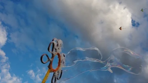 Bubbles with blue sky background with clouds Video stock 100941705
