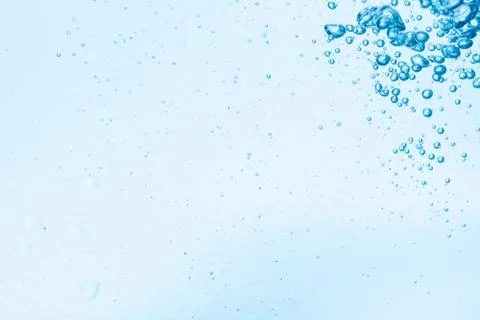 Bubbles in blue water background. Stock Photos
