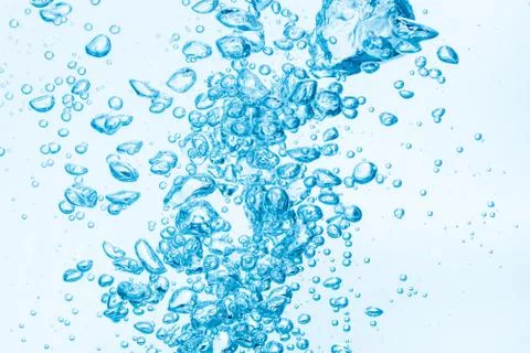 Bubbles in blue water background. Stock Photos