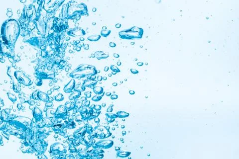 Bubbles in blue water background. Stock Photos