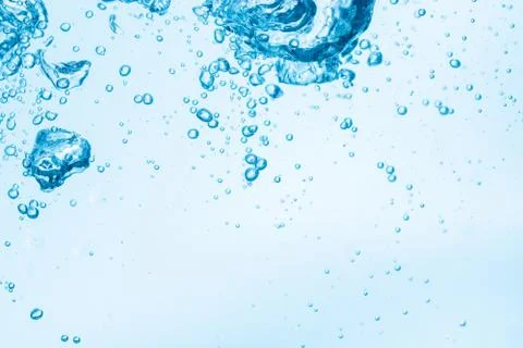Bubbles in blue water background. Stock Photos