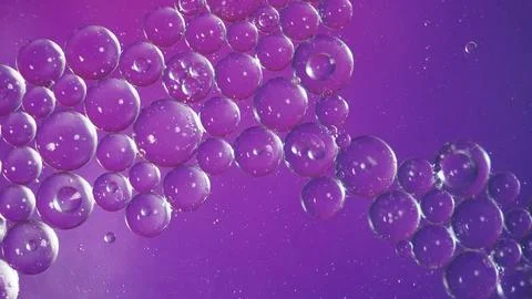 Bubbles blur abstract in violet and dark blue background Stock Photos