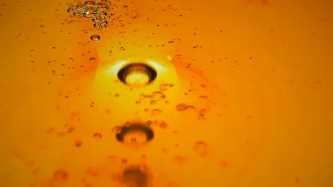 Bubbles of boiling oil rise up Stock Footage 82482310