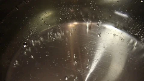 The bubbles of boiling water in a saucepan Stock-Footage 83024857