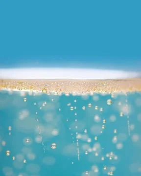 Bubbles carbonation in macro liquid texture. Bubbles transparent droplets wit Stock Photos