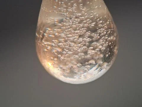 Bubbles in a Clear Liquid with Golden Light and Abstract Texture Stock Photos