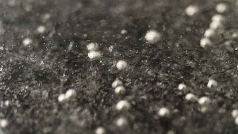 Bubbles in a clear thick boiling liquid. Close up, shallow focus. Stock Footage 163124399