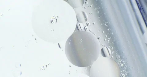 Bubbles in color jello cream (gel soap). Extreme macro 4k Stock Footage