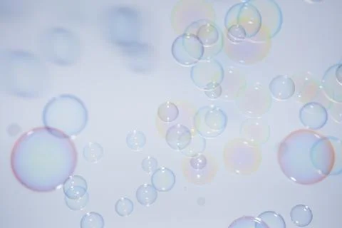 Bubbles colorful background white Stock Photos