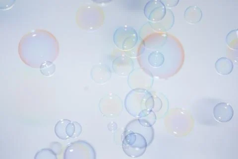 Bubbles colorful background white Stock Photos