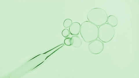 Bubbles comes out from dropper and float on surface of liquid Video stock 167158953