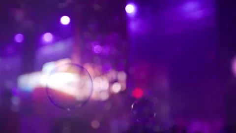 Bubbles coming out of bubble machine with shallow depth of field 動画素材 293940653