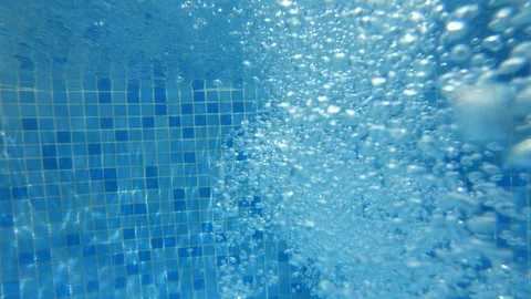 Bubbles coming out of a pool jet filling hose Stock Footage 91653913