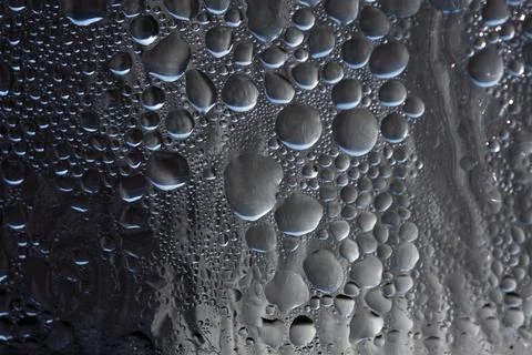 Bubbles of condensation on window abstract 스톡 사진