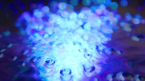 Bubbles converge on center of colored vortex Stock Footage 36272669
