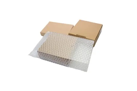 Bubbles covering the box by bubble wrap for protection product 스톡 사진