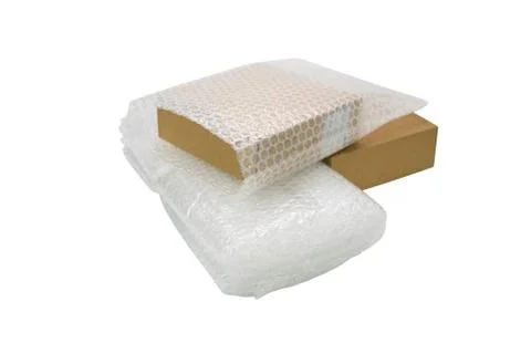 Bubbles covering the box by bubble wrap for protection product 스톡 사진