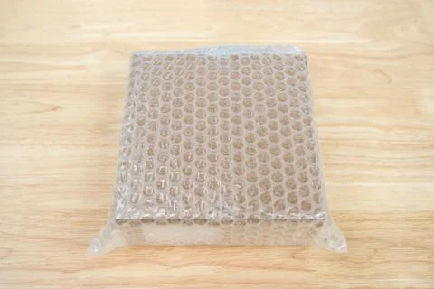 Bubbles covering the box by bubble wrap for protection product 스톡 사진