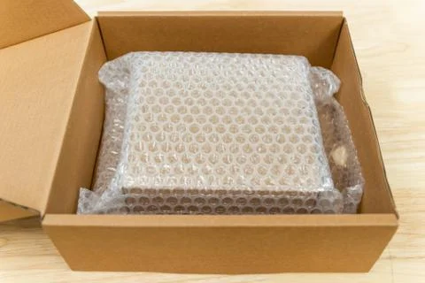 Bubbles covering the box by bubble wrap for protection product Stock Photos