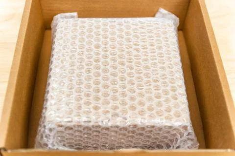 Bubbles covering the box by bubble wrap for protection product Stock Photos