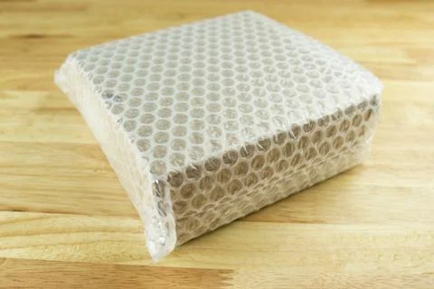 Bubbles covering the box by bubble wrap for protection product Stock Photos