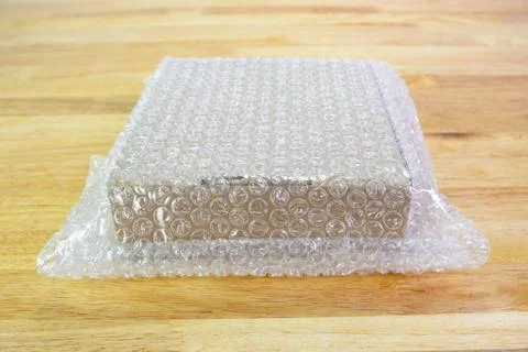 Bubbles covering the box by bubble wrap for protection product cracked 스톡 사진