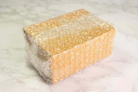 Bubbles covering the box by bubble wrap for protection product 스톡 사진