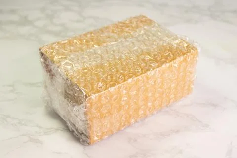 Bubbles covering the box by bubble wrap for protection product Stock Photos