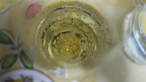 Bubbles in a cup of champagne Stock Footage 236941246