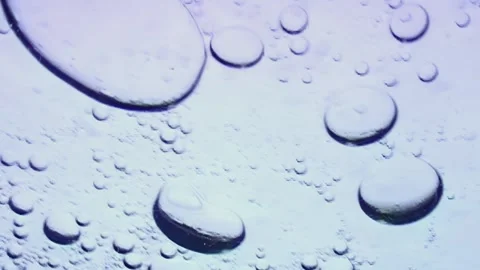 Bubbles dance beneath ice in the frigid Arctic waters at twilight Stock Footage 314132172