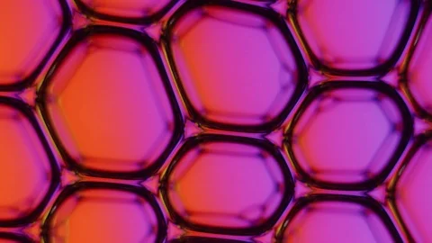 Bubbles disappear in liquid on pink, purple and orange background Stock Footage