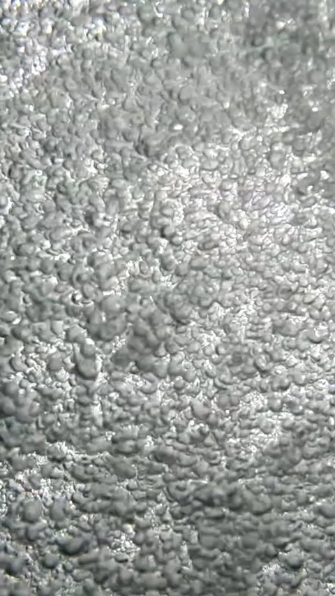 Bubbles emerge from the surface of water during midday at the lake Stock Footage 332936687