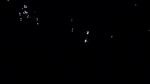 Bubbles falling against black background Stock Footage 82169716