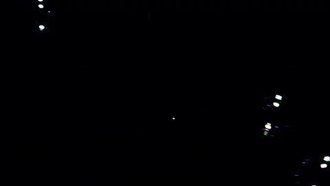 Bubbles falling against black background Stock Footage 82169740