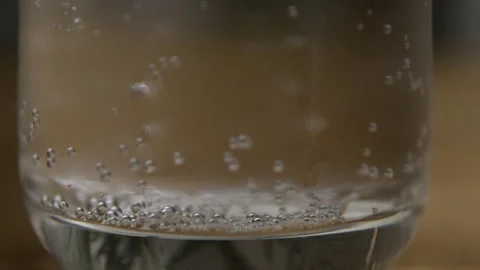 Bubbles from a Fizzy Drink Float to the Top from the Bottom of a Glass Stock Footage 270406854