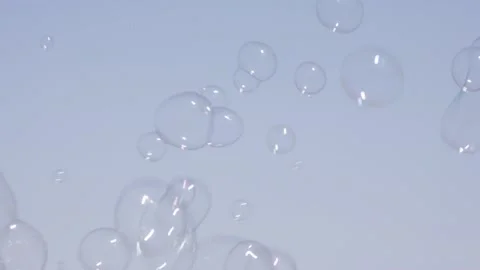 Bubbles float by in the air Stock Footage 165282059