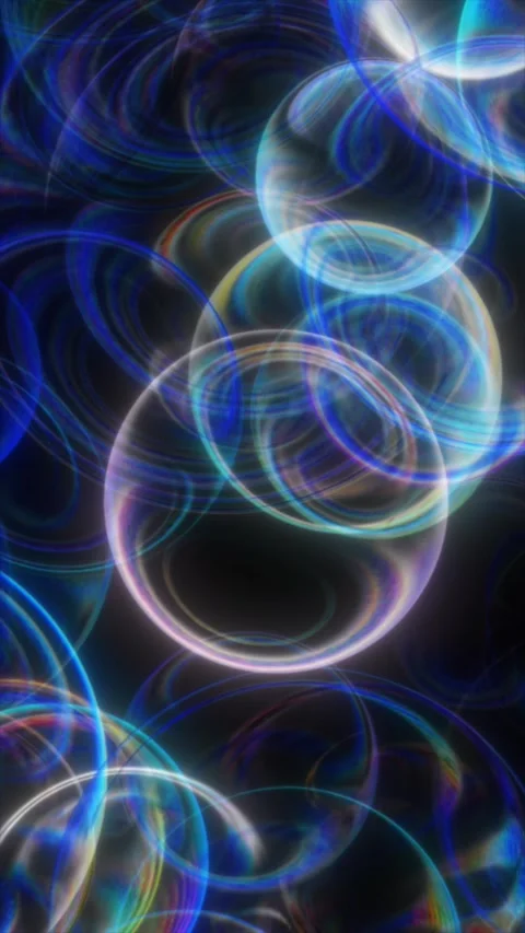 Bubbles float in vibrant colors against a dark backdrop Stock Footage 312387577