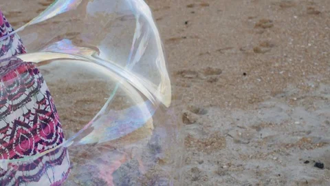 Bubbles floating in air at beach at sunset slow motion Stock Footage 118059483