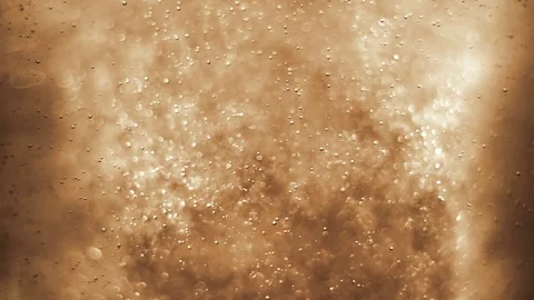 Bubbles floating in the amazing deep structured white gold liquid. Stock Footage 79833188