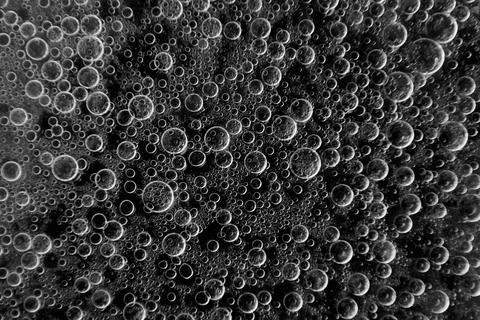 Bubbles Floating in Dark Liquid During a Mixing Process in a Kitchen Laborato Stock Photos