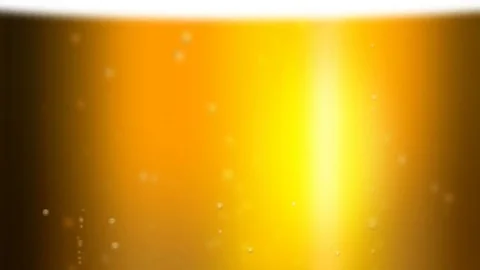 The bubbles floating up in the liquid of beer. Stock Footage 70992239