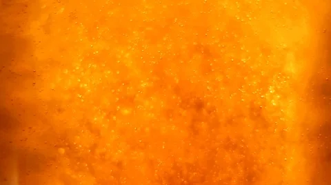 Bubbles floating up in the liquid drink Stock Footage 63314644