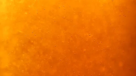 Bubbles floating up in the liquid drink Stock Footage 63315254