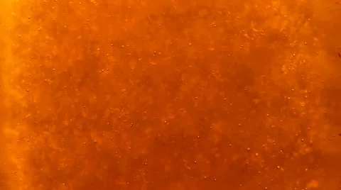 Bubbles floating up in the liquid drink Stock Footage 63315337