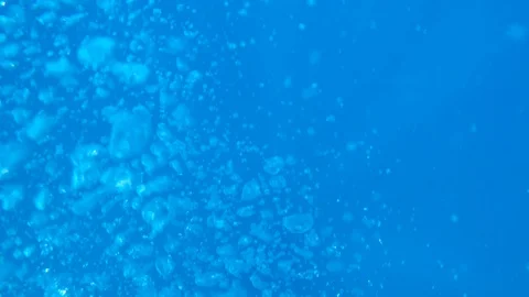 Bubbles floating up from a scuba diver below. Stock Footage 104115638
