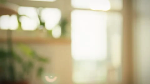 Bubbles floating in sunlight create a serene atmosphere in a cozy indoor spa Stock Footage 323731571