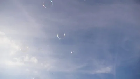 Bubbles floating through the sky, slow motion 스톡 동영상 74630336
