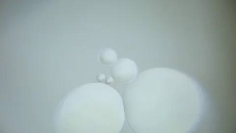 Bubbles floating in water against grey background Stock Footage 76103028